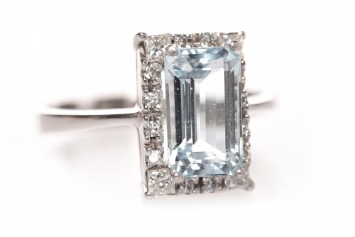 Lot 146 - AQUAMARINE AND DIAMOND RING set with a central...