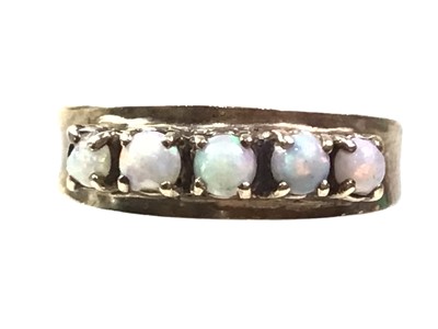 Lot 70 - OPAL FIVE STONE RING