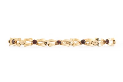 Lot 701 - GARNET BOW BRACELET