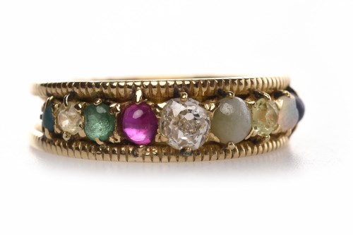 Lot 212 - MULTI GEM SET BAND of tapered form and set...