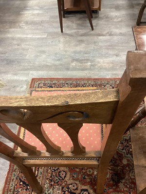 Lot 463 - IN THE MANNER OF C.F.A. VOYSEY, SET OF EIGHT ARTS & CRAFTS OAK DINING CHAIRS