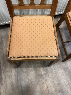 Lot 463 - IN THE MANNER OF C.F.A. VOYSEY, SET OF EIGHT ARTS & CRAFTS OAK DINING CHAIRS