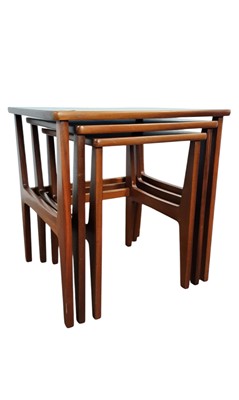 Lot 559 - MID-CENTURY TEAK NEST OF THREE TABLES