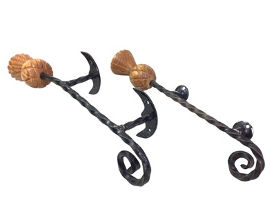 Lot 174 - SET OF SIX WROUGHT IRON AND CARVED WOOD THISTLE DOOR HANDLES
