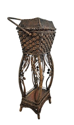 Lot 560 - CANEWORK WORK BASKET ON ORNATE STAND