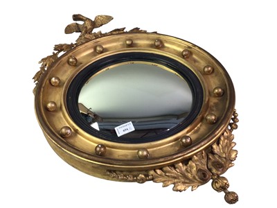Lot 654 - CONVEX WALL MIRROR IN A GILT FRAME