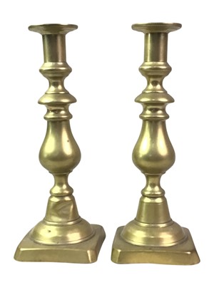 Lot 408 - TWO PAIRS OF BRASS CANDLESTICKS