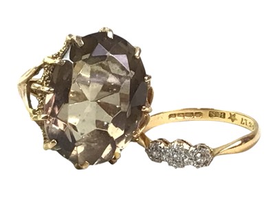 Lot 611 - DIAMOND THREE STONE RING AND A SMOKY QUARTZ RING