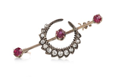 Lot 551 - RUBY AND DIAMOND CRESCENT MOON BROOCH