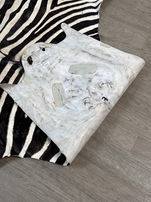 Lot 580 - ZEBRA HIDE RUG