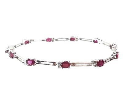 Lot 664 - RUBY AND DIAMOND BRACELET