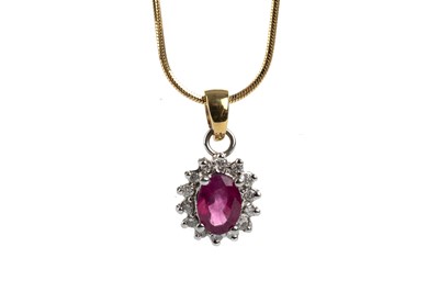 Lot 595 - RUBY AND DIAMOND PENDANT ON CHAIN