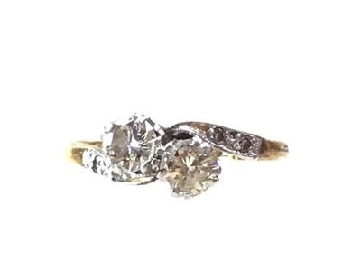 Lot 682 - DIAMOND TWO STONE CROSSOVER RING