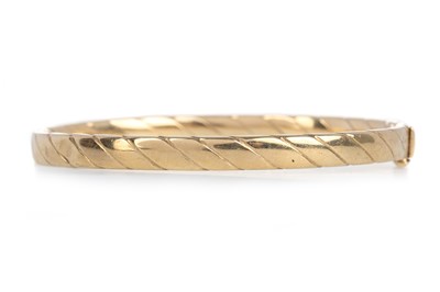 Lot 606 - NINE CARAT GOLD BANGLE