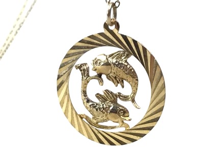 Lot 452 - NINE CARAT GOLD ZODIAC PENDANT