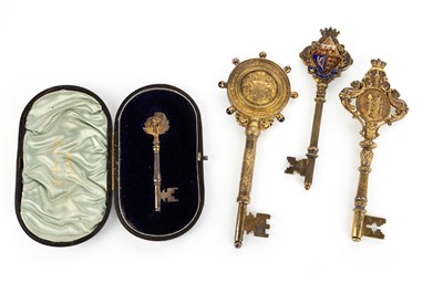 Lot 1075 - FOUR SILVER-GILT PRESENTATION KEYS