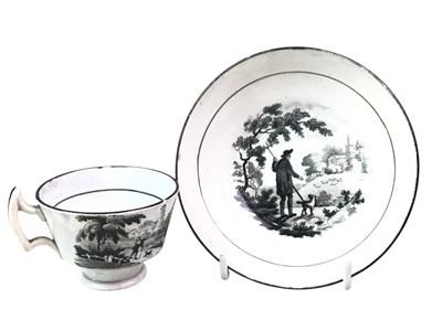 Lot 536 - TWO BLACK AND WHITE CUPS AND SAUCERS