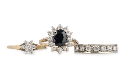 Lot 529 - GEM SET HALF ETERNITY RING