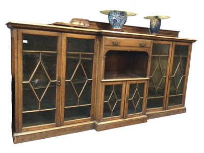 Lot 483 - LATE VICTORIAN OAK BREAKFRONT BOOKCASE