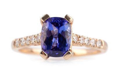 Lot 554 - TANZANITE AND DIAMOND RING