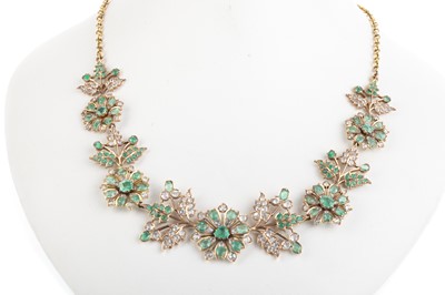 Lot 569 - EMERALD AND WHITE SAPPHIRE FLOWER NECKLET