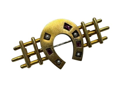 Lot 254 - VICTORIAN RUBY AND SEED PEARL HORSE SHOE BAR BROOCH