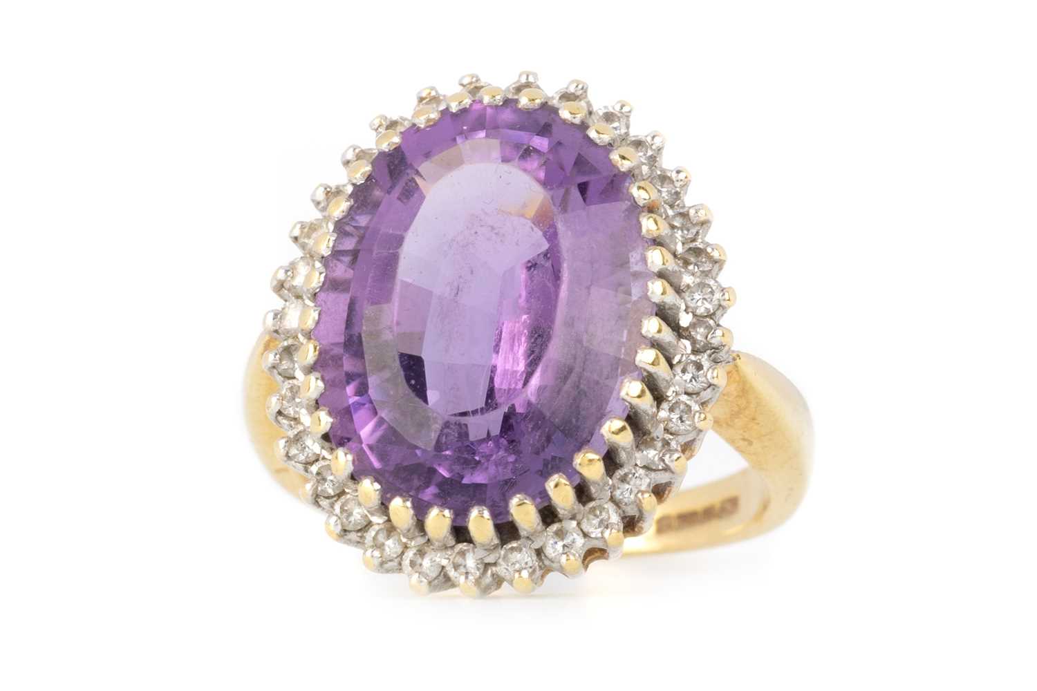 Lot 404 - AMETHYST AND DIAMOND RING