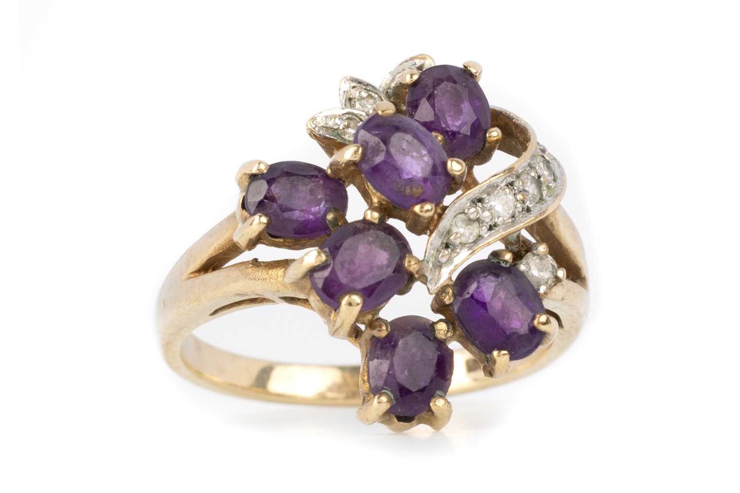 Lot 402 - AMETHYST AND DIAMOND CLUSTER RING