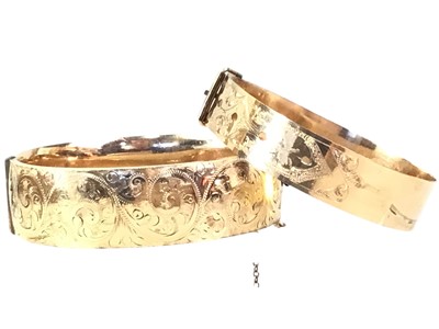 Lot 207 - TWO ROLLED GOLD BANGLES
