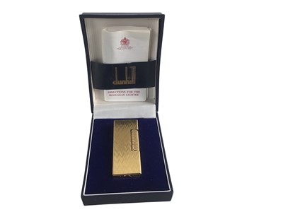 Lot 615 - THREE CIGARETTE LIGHTERS