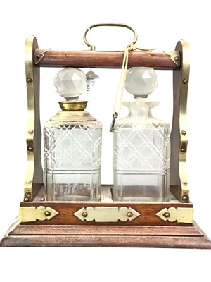 Lot 121 - MAHOGANY AND BRASS BOUND TANTALUS