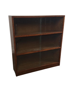 Lot 276 - THREE OAK GLAZED BOOKCASES