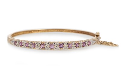 Lot 556 - RUBY AND DIAMOND BANGLE