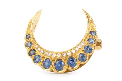 Lot 559 - SAPPHIRE AND DIAMOND CRESCENT MOON BROOCH
