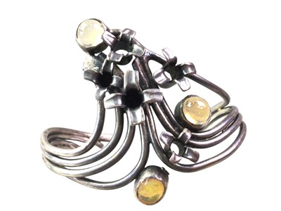 Lot 452 - GEM SET SILVER BANGLE
