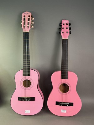Lot 555 - THREE PINK GUITARS