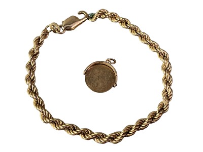 Lot 3 - GOLD BRACELET, DOG CLIP AND A CHARM