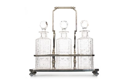 Lot 592 - VICTORIAN SILVER PLATED THREE BOTTLE TANTALUS