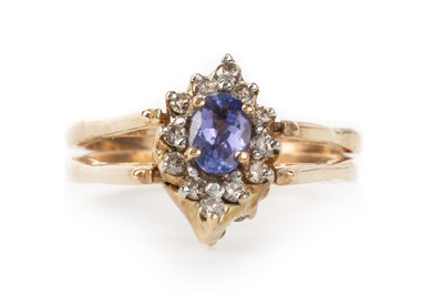 Lot 436 - TANZANITE AND DIAMOND REVERSIBLE CLUSTER RING