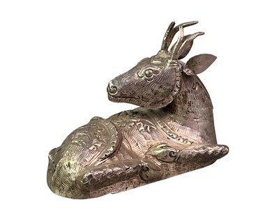 Lot 166 - ASIAN WHITE METAL FIGURE OF A RESTING STAG