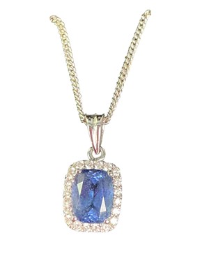 Lot 232 - TANZANITE AND DIAMOND PENDANT ON CHAIN