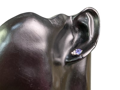 Lot 233 - TANZANITE AND DIAMOND PENDANT ON CHAIN