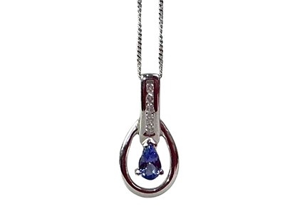 Lot 239 - TANZANITE AND DIAMOND PENDANT ON CHAIN