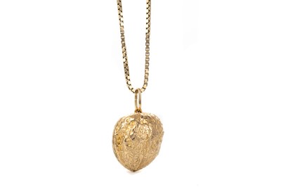 Lot 713 - NINE CARAT GOLD WALNUT PENDANT ON CHAIN