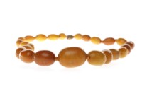 Lot 3 - BUTTERSCOTCH AMBER NECKLACE formed by...