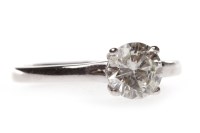 Lot 6 - DIAMOND SOLITAIRE RING with a four claw set...