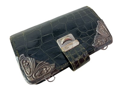 Lot 121 - EDWARDIAN SILVER MOUNTED CROCODILE LEATHER PURSE