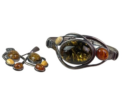 Lot 243 - SILVER AND AMBER BANGLE