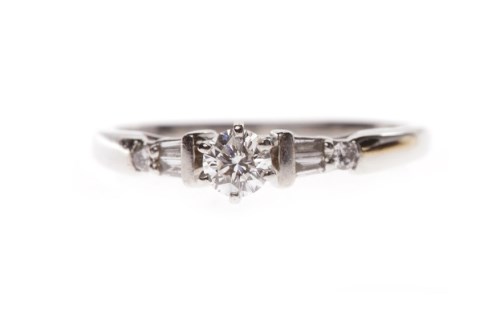 Lot 73 - PLATINUM DIAMOND SOLITAIRE RING with a six...