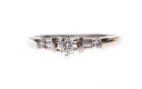 Lot 73A - PLATINUM DIAMOND SOLITAIRE RING with a six...